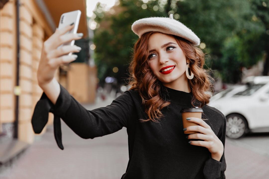 influencer taking selfie with phone