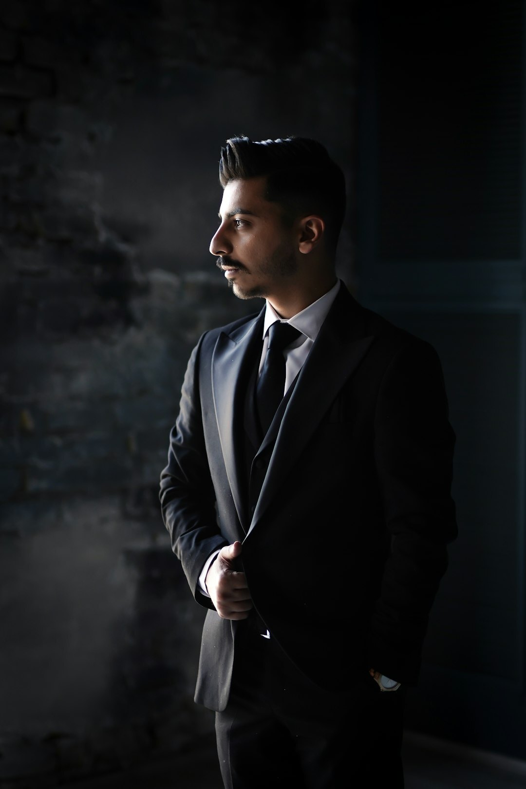 Studio portrait of a European actor in a tailored suit